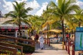 Beach entrance with a pier and a boat in Mahogany Bay, Roatan, Honduras Royalty Free Stock Photo