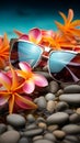Beach essentials Sunglasses, colorful flowers, and tropical palm leaves for a perfect summer