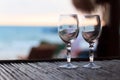 Beach evening on the sunset with two glasses