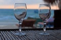 Beach evening on the sunset with two glasses