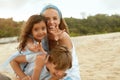 Beach. Family Portrait Of Happy Mother, Son And Daughter. Young Woman In Fashion Dress With Little Girl And Boy. Royalty Free Stock Photo