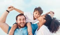 Beach, father and a mother kiss child on the cheek while on a vacation, holiday or adventure. A woman, man and kid on Royalty Free Stock Photo