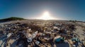 A beach filled with lots of trash next to the ocean. AI generative image