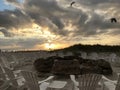 Beach fire circle with clouds and seagulls Royalty Free Stock Photo