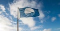 Beach Flag at ISLE OF ANGLESEY, GWYNEDD, NORTH WALES -