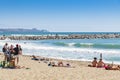 Beach-front people bathing in waves Fuengirola Spain Royalty Free Stock Photo