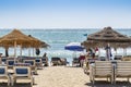 Beach-front with people sunbathing Fuengirola Spain