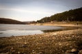 Beach by the frozen lake. Beautiful sunny winter day. Royalty Free Stock Photo