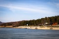 Beach by the frozen lake. Beautiful sunny winter day. Royalty Free Stock Photo