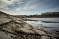 Beach by the frozen lake. Beautiful sunny winter day. Royalty Free Stock Photo