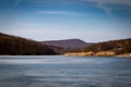 Beach by the frozen lake. Beautiful sunny winter day. Royalty Free Stock Photo