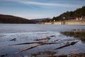 Beach by the frozen lake. Beautiful sunny winter day. Royalty Free Stock Photo