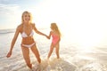 Beach, fun or happy mother and daughter holding hands at sea with love, support and bonding in nature together. Freedom Royalty Free Stock Photo