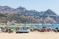 Beach in Giardini Naxos and view of Taormina city