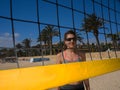 Beach girl smiling behind the volleyball net Royalty Free Stock Photo