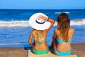 Beach girls rear back biew sitting in the beach Royalty Free Stock Photo