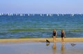 Beach girls and sailing boats race