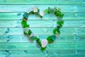 Beach glass collection in the shape of a heart on blue planks