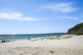 Beach-goers enjoying summer on white sand of Chinaman\'s Beach