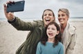 Beach, grandma and child selfie with phone for happy family holiday break together in Canada. Mother, daughter and