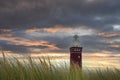 Beach grass with lighthouse Westhoofd in Ouddorp in the Netherlands