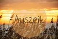 Beach Grass At Sunrise Or Sunset, Text Auszeit Means Downtime