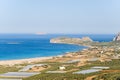 The beach by the greenhouses and olive trees in the countryside , in Europe, in Greece, in Crete, towards Kissamos, towards Chania Royalty Free Stock Photo