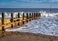 Wooden Beach Defense Groins with Waves