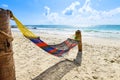 Beach hammock on sand sea waves water and coast seascape - View of beautiful tropical landscape beach sea island with ocean blue Royalty Free Stock Photo