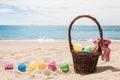 Beach Happy Easter background with basket and color eggs Royalty Free Stock Photo