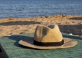 Beach hat on a sun lounger near the sea sunlit horizontal