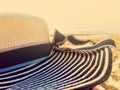 Beach hat wide large brim on a beach at sunset