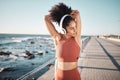 Beach, headphones and woman stretching for a fitness exercise, running or training for a race or marathon. Health Royalty Free Stock Photo