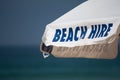 Beach hire umbrella sign Royalty Free Stock Photo