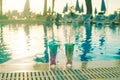 Beach holidays background with two cocktails In mermaid tail glass near swimming pool in luxurious hotel Royalty Free Stock Photo