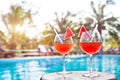 Beach holidays background with two cocktails near swimming pool in luxurious hotel Royalty Free Stock Photo