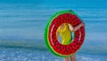 Beach vacations in summer on the seashore. A child with an inflatable ring. Safe rest on the sea. summer tourist offer. Royalty Free Stock Photo