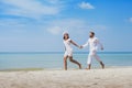 beach honeymoon travel, tropical vacation for couple, holidays on the sea, man and woman walking together Royalty Free Stock Photo