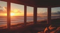 A beach house with large windows overlooking the ocean at sunset Royalty Free Stock Photo