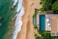 Beach house with pool on oceanfront, top view.