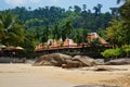 beach with house and rocks Royalty Free Stock Photo