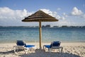 Beach hut and chairs on tropical island Royalty Free Stock Photo