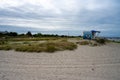 A beach hut for life guards at a beach in Malmo, Sweden. Blue ocean and blue cloudy sky