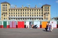 Beach huts and buildings on Brighton promenade Royalty Free Stock Photo