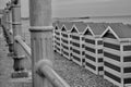 Monochrome image of beach huts on the beach at Hastings, Eangland UK