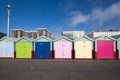 Beach huts on Hove seafront in Brighton, Sussex, UK, with apartment block buildings Royalty Free Stock Photo