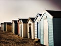 Beach huts on the sand on a cold winter day Royalty Free Stock Photo