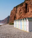 Beach huts and sandstone cliffs Budleigh Salterton