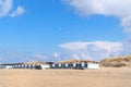 Beach huts and seagulls at the beach Royalty Free Stock Photo