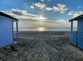Between the beach huts at West Wittering Royalty Free Stock Photo